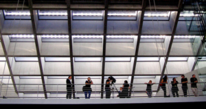 People in business suits in a big building