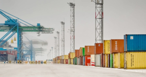 Shipping Crates with cranes on a wharf